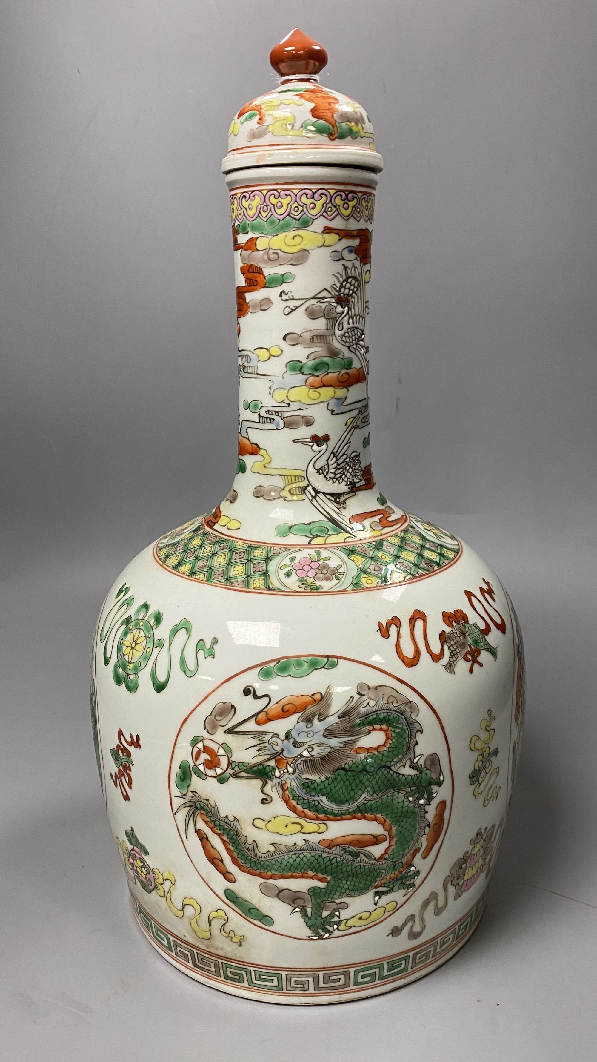 A Chinese famille rose dragon and phoenix bottle vase and cover, 42cm